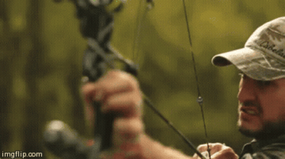 Man In Camo Hat Holding Bow And Arrow GIF