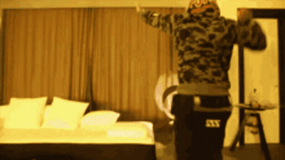 Man In Camo Jacket Dancing In Room GIF