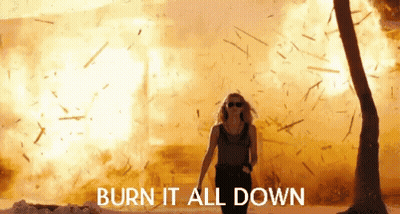Man In Camo Jacket Holding Torch GIF
