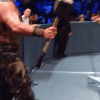 Man In Camouflage Holding Hammer GIF