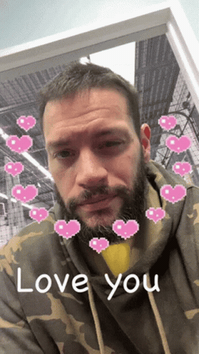 Man In Camouflage Hoodie With Pink Hearts Saying Love You GIF