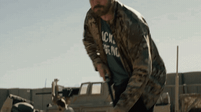 Man In Camouflage Jacket And T-Shirt By Truck GIF