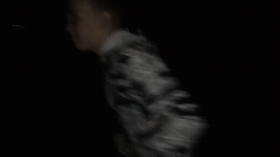 Man In Camouflage Jacket Dark GIF