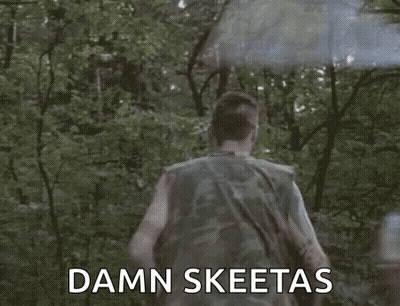 Man In Camouflage Running Through Woods With Smoke Bomb GIF