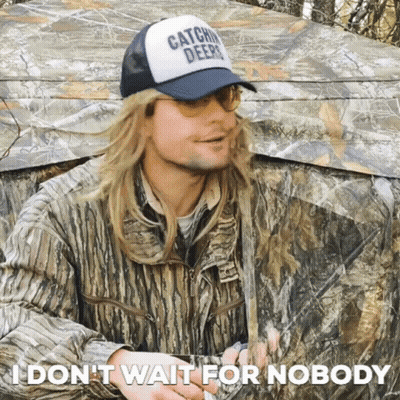 Man In Camouflage Tent Wearing Hat Saying Catchin Deer GIF