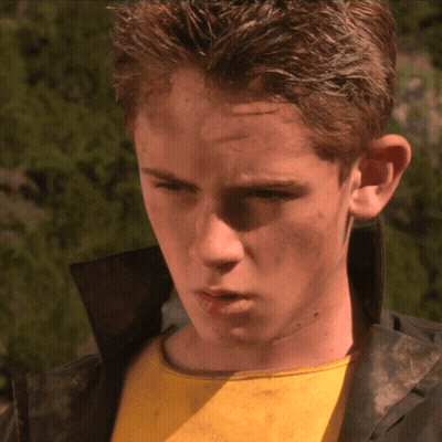 Man In Cape In Front Of Batman Logo GIF