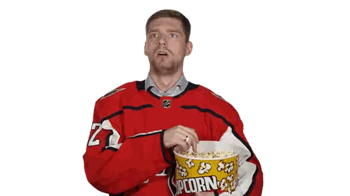 Man In Capitals Jersey Holding Popcorn Sticker