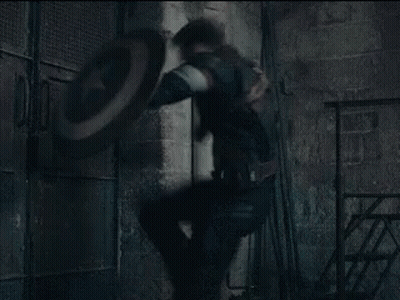 Man In Captain America Uniform Holding Shield GIF