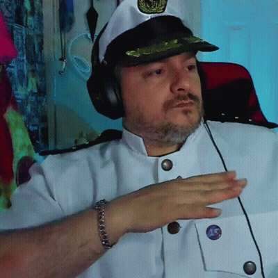 Man In Captain Hat And Headphones With Purple Button Saying 15 GIF