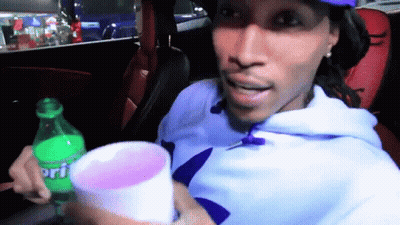 Man In Car Holding Sprite Bottle And Cup GIF