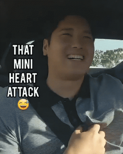 Man In Car Smiling Saying Mini Heart Attack GIF