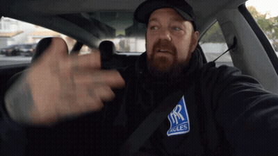 Man In Car Wearing Rolls Royce Sweatshirt GIF