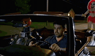 Man In Car With Sign Saying I Will Chase You Down GIF