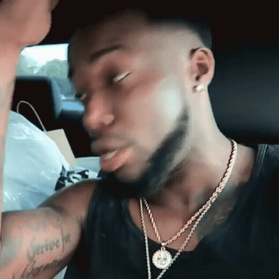 Man In Car With Survive Tattoo GIF