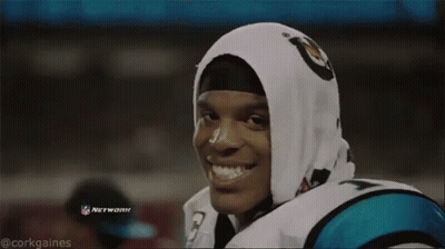 Man In Carolina Panthers Jersey Eating Hamburger GIF