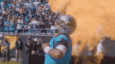 Man In Carolina Panthers Uniform In Front Of Fireball GIF