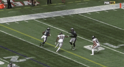 Man In Carolina Panthers Uniform Smoking Cigarette GIF