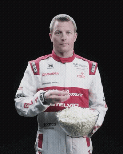 Man In Carrera Uniform Holding Bowl Of Popcorn GIF