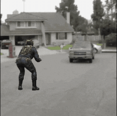 Man In Cat Costume Dancing In Front Of House And Car GIF