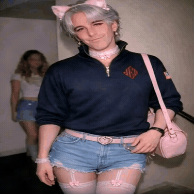 Man In Cat Ear Headband And Shorts With Pink Bag GIF