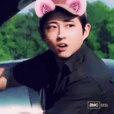 Man In Cat Hat With Pink Ears Sitting In Car GIF