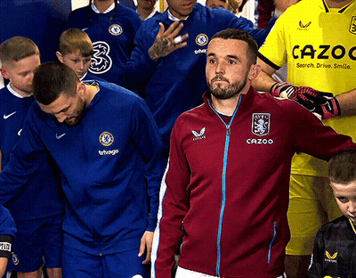 Man In Cazoo Jacket In Line With Players GIF