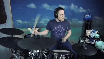Man In Celeste Shirt Playing Drums GIF