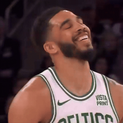 Man in Celtics Jersey Smiling