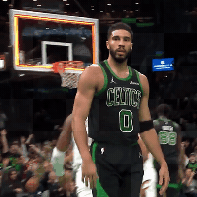 Man In Celtics Jersey Standing In Front Of Basketball Net GIF