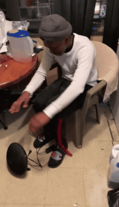 Man In Chair Feet On Speaker Saying Champion GIF