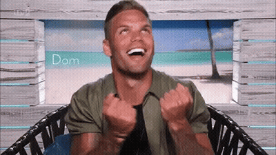Man In Chair Laughing Arms Up GIF