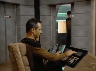 Man In Chair Using Device Saying Command GIF
