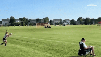 Man In Chair Watches Girl Throw Frisbee GIF