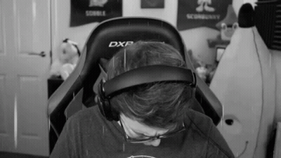Man In Chair With Headphones And Glasses GIF