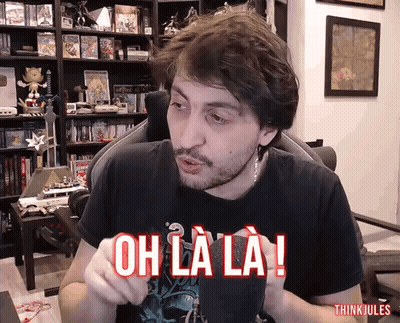 Man In Chair With Oh La La Shirt GIF