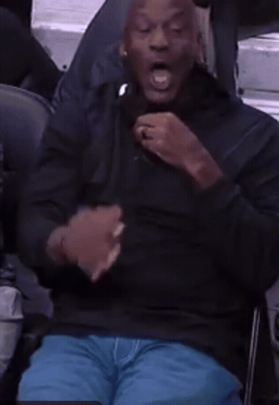 Man In Chair With Open Mouth And Hands Outstretched GIF