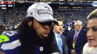 Man In Champions Hat Talking Into Microphone GIF