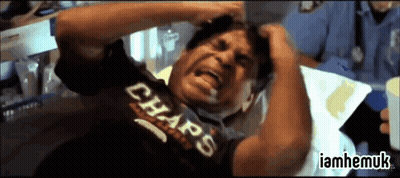 Man In Chaps Shirt Laying In Hospital Bed With Hands On Head GIF