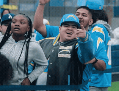 Man In Chargers Jacket Pointing GIF