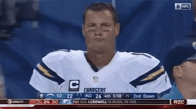 Man In Chargers Jersey Looking At Camera GIF