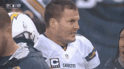 Man In Chargers Jersey Talking To Man In Helmet GIF
