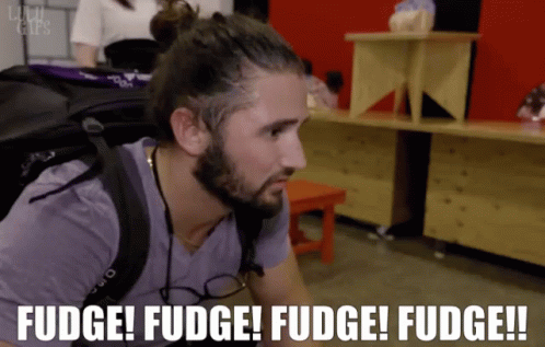 Man In Checkered Shirt Near Netflix Logo GIF