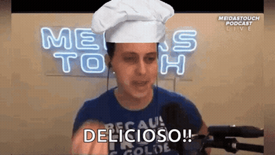 Man in Chef Hat Saying Delicious at Microphone