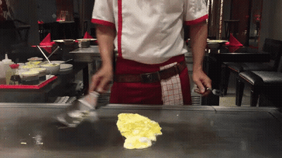 Man In Chef's Uniform Cooking On Stove GIF