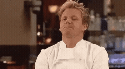 Man in Chef's Uniform Making Funny Face at Bar