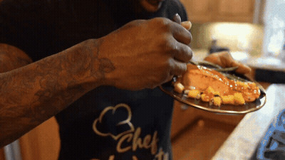 Man In Chef Shirt Eating Food GIF