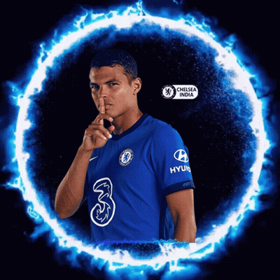Man In Chelsea India Shirt Holding Finger To Lips GIF