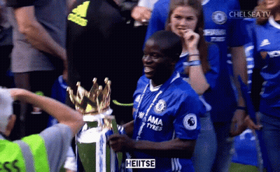 Man In Chelsea Jersey Holding Trophy In Front Of Crowd GIF