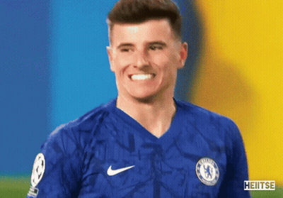Man In Chelsea Jersey Smiling At Camera GIF