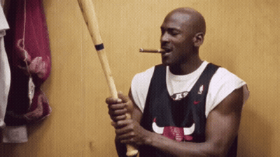 Man In Chicago Bulls Jersey Smoking Cigar Holding Baseball Bat GIF